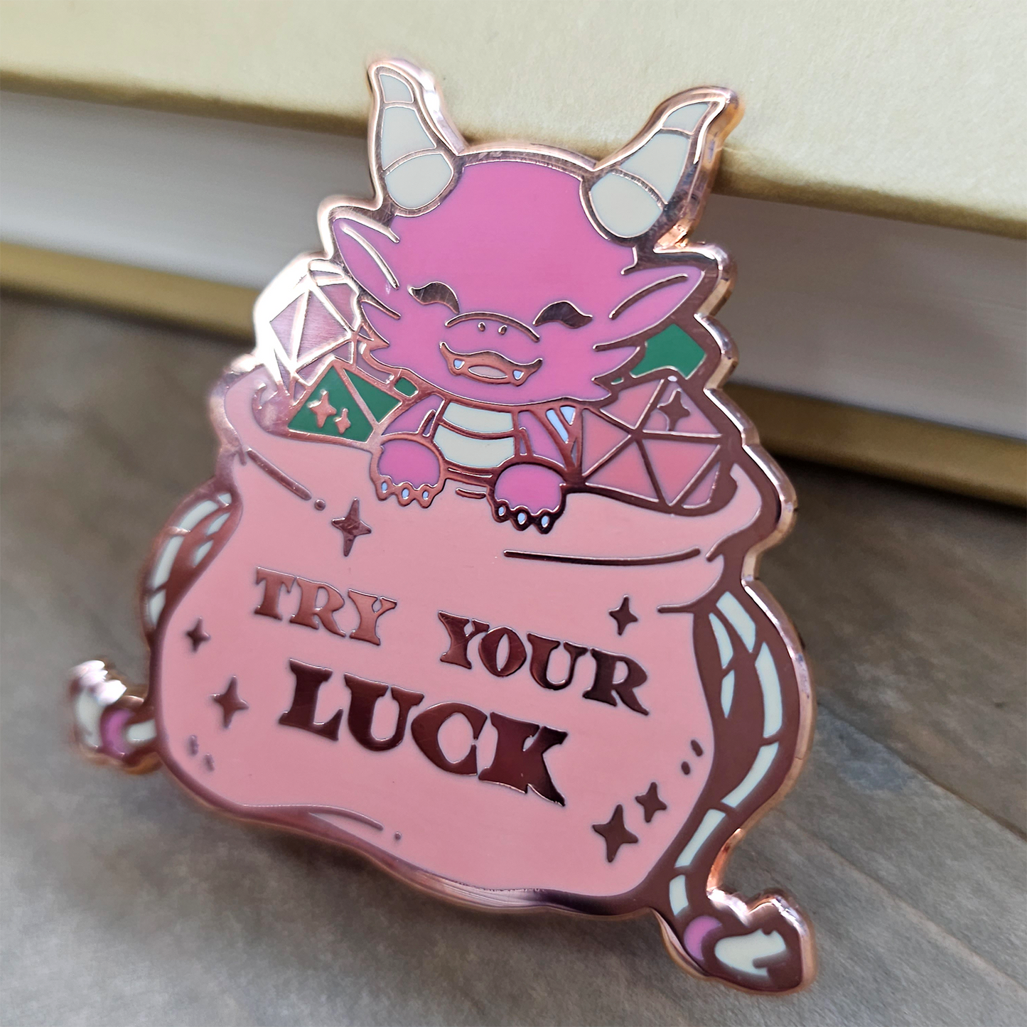 Pink Dragon in Dice Bag Enamel Pin