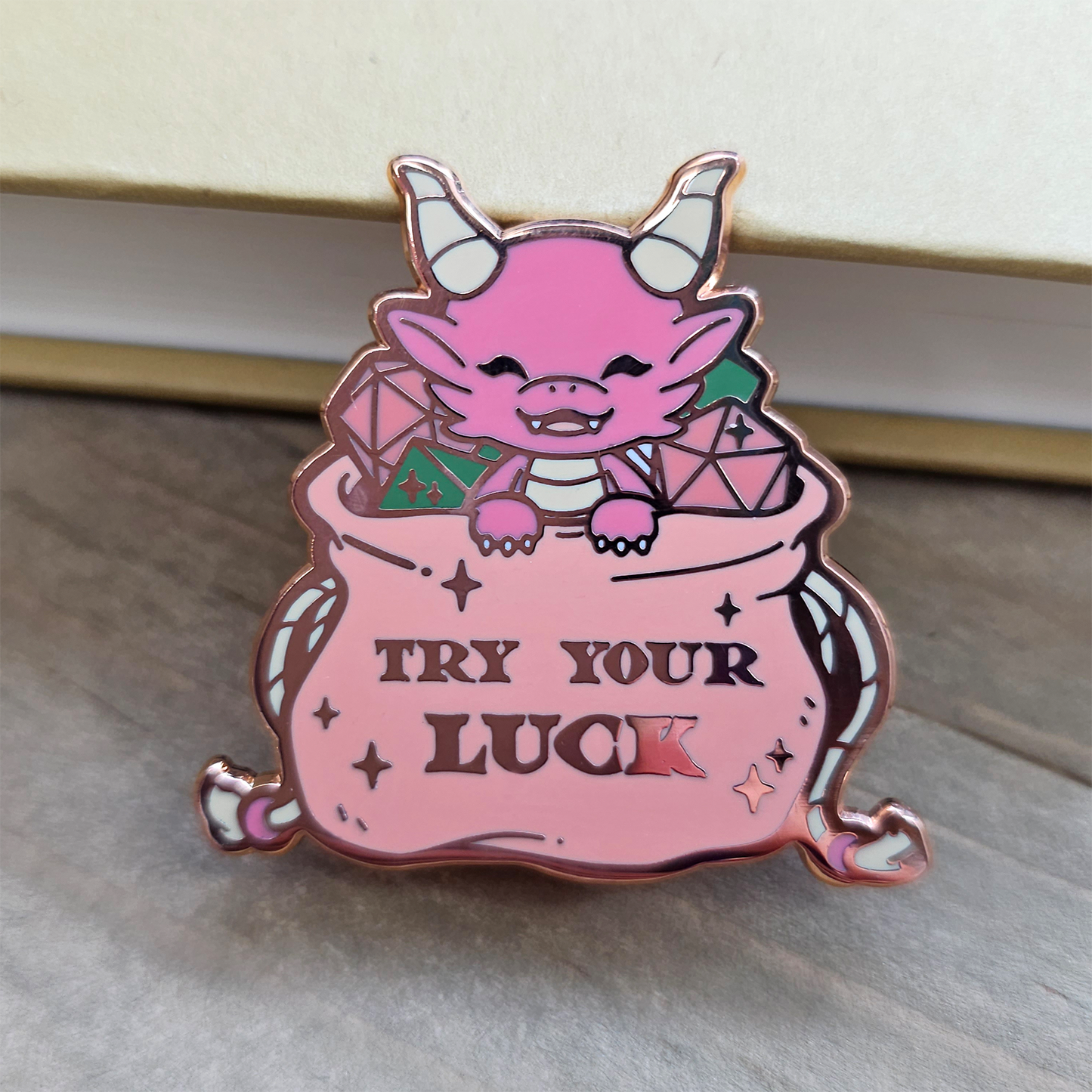 Pink Dragon in Dice Bag Enamel Pin